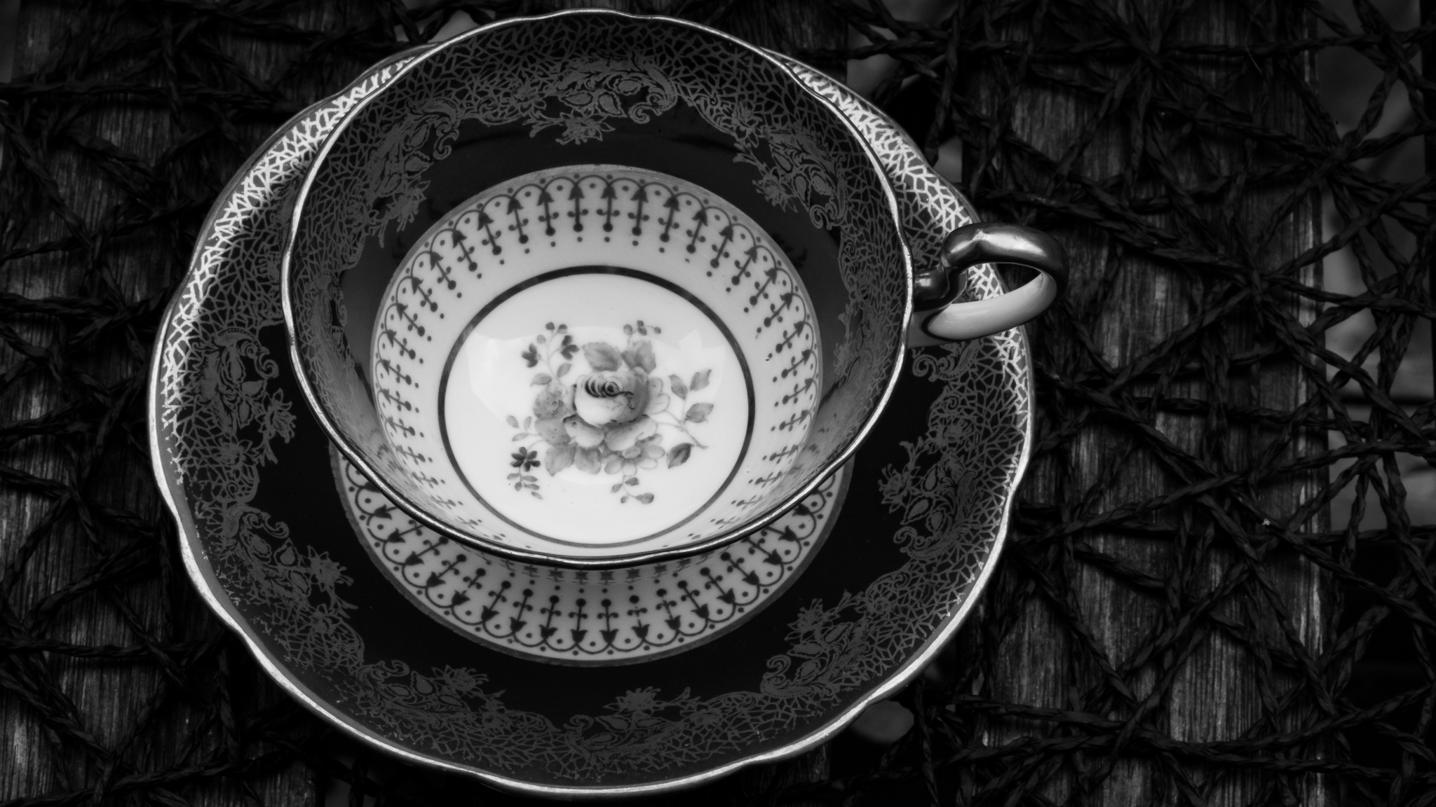 Vintage patterned teacup and saucer in black and white