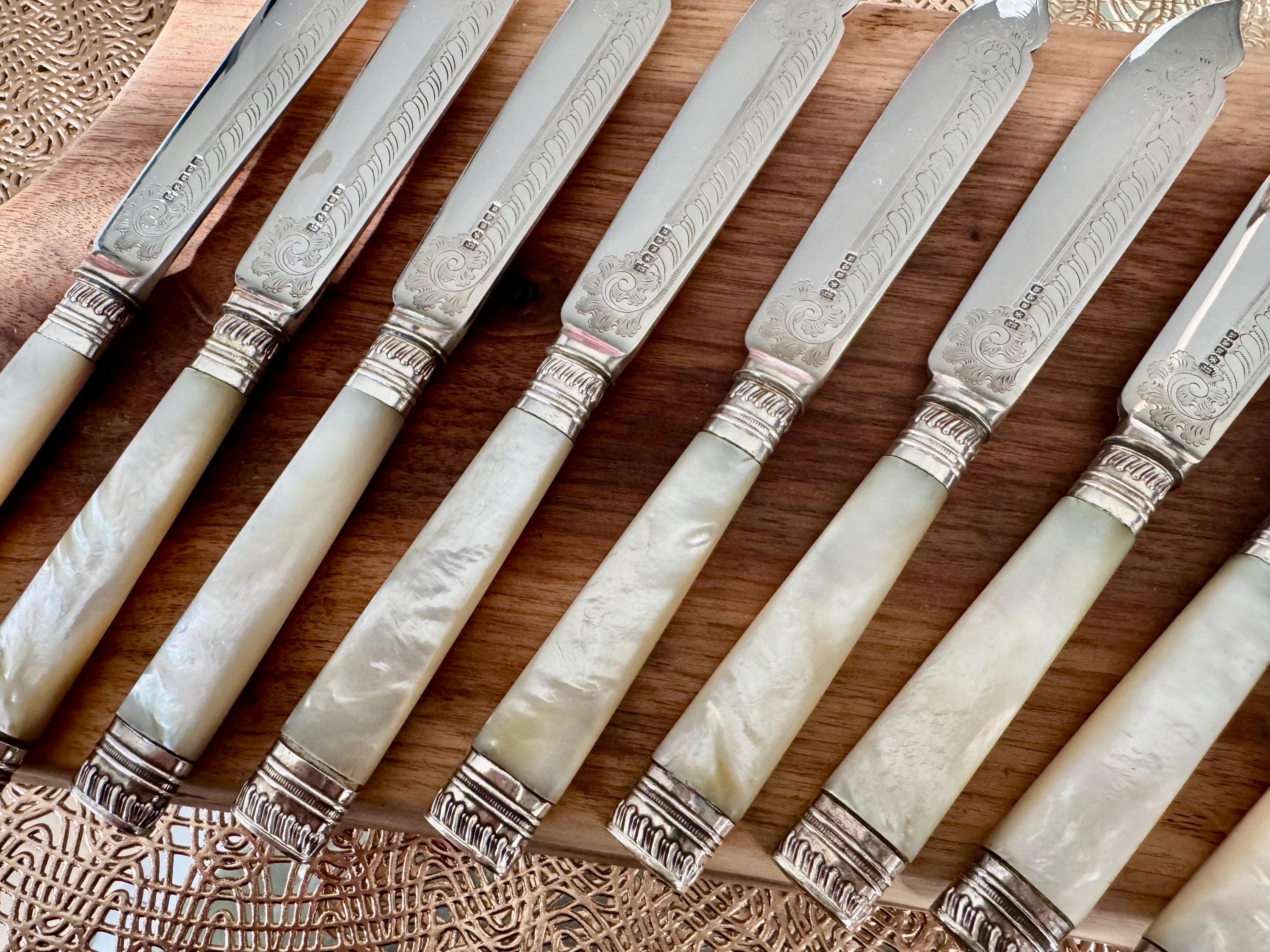 Vintage Mother of Pearl Silverplate Knives: Engraved Elegant Set of 10, front view