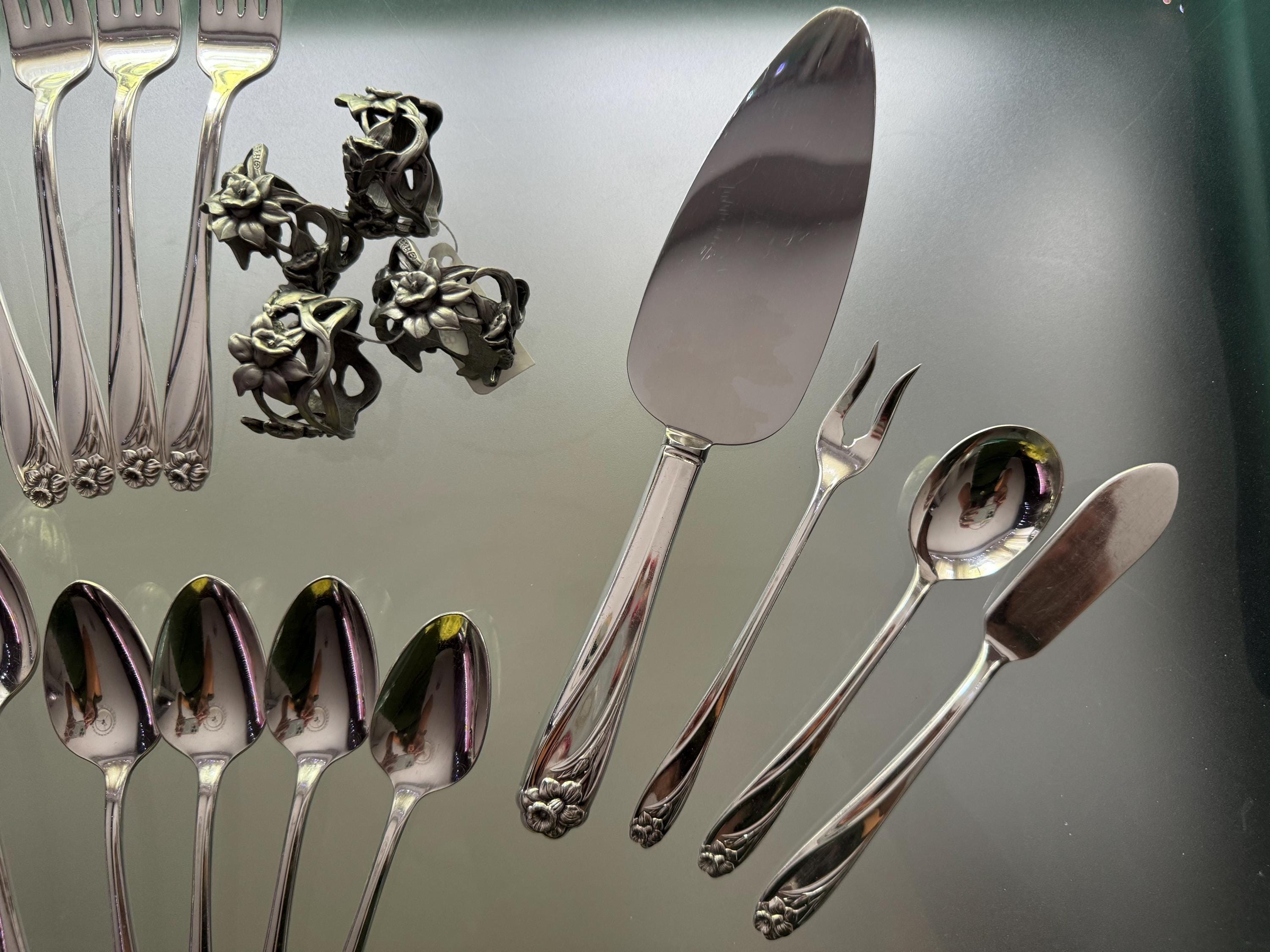 Vintage Seagull Pewter “Daffodil” Napkin Rings & Matching “Daffodil” Silverware - Set for Four Persons, front view